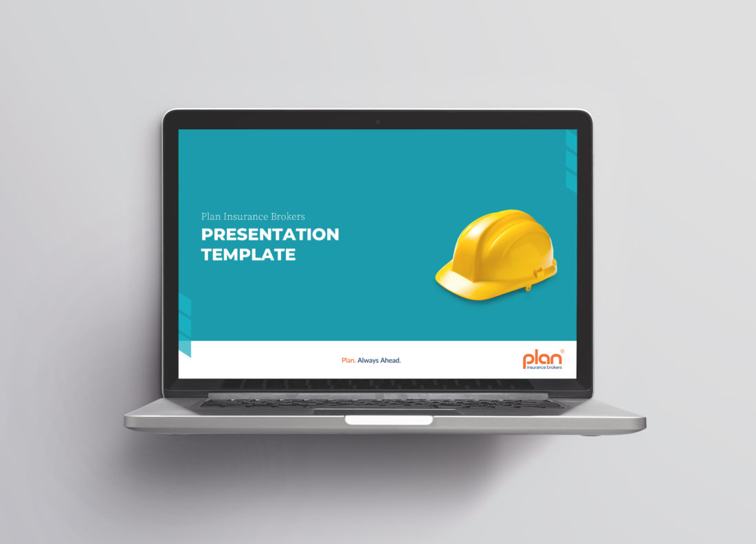 Laptop shows a presentation template title page. The design consists of a yellow construction helmet on a turquoise background